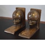 Pair of hardwood bookends with carvings of African heads