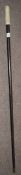 Ebonised walking cane with carved bone handle, brass ferrule