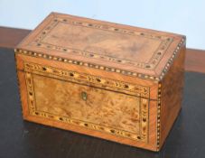 Victorian walnut cross banded parquetry inlaid tea caddy, the interior with two compartments, 23cm