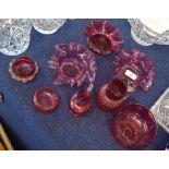 Group of cranberry glass wares including two small jugs and various bowls, (8)