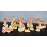 Group of Staffordshire wares including a number of greyhound models, two with hares in mouths, and