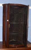 19th century mahogany bow fronted wall mounted corner cabinet with fitted interior, 59cm wide