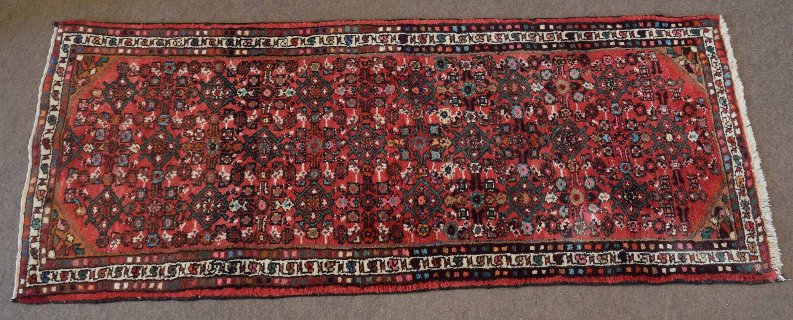 20th century Caucasian runner, all over central geometric pattern mainly pale red field with