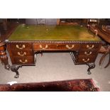 Early 20th century mahogany partner's desk, gilt tooled green leather inset fitted on one side