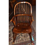 Stick back oak rocking chair with solid seat