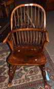 Stick back oak rocking chair with solid seat