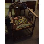 Oak carver chair with carved back, tapestry seat and barley twist front stretcher