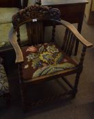 Oak carver chair with carved back, tapestry seat and barley twist front stretcher