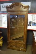 European walnut Biedermeier style glazed front display cabinet with arched top and full width frieze