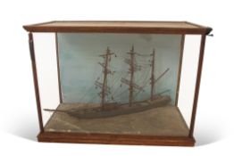 19th century model of a three-masted clipper or sloop in light oak frame, 77cm long