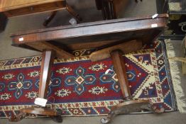 Rosewood centre table, of rectangular form with a plain frieze raised on two tapering octagonal