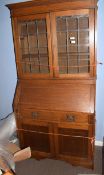 Edwardian bureau bookcase, inlaid with geometric panels and leaded glazed top enclosing fitted