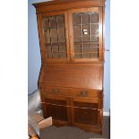 Edwardian bureau bookcase, inlaid with geometric panels and leaded glazed top enclosing fitted