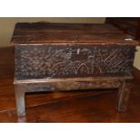 Oak bible box (probably constructed from a coffer), two planked top over a carved front and raised