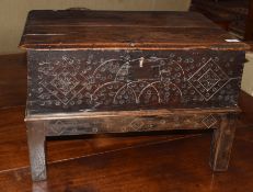 Oak bible box (probably constructed from a coffer), two planked top over a carved front and raised