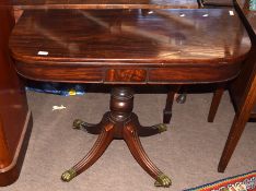 Regency period mahogany tea table with fold top, over balustered support terminating in a