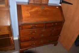 George III mahogany bureau, fitted interior and five drawers below on bracket feet, 1.06m wide