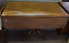 19th century mahogany pedestal Pembroke table with two drop flaps and a frieze fitted at either