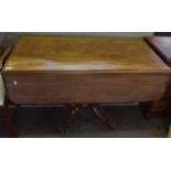 19th century mahogany pedestal Pembroke table with two drop flaps and a frieze fitted at either