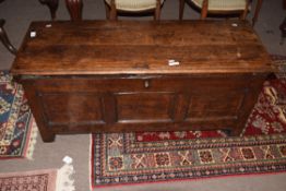 Oak coffer, three panelled front on plain stile supports