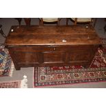 Oak coffer, three panelled front on plain stile supports