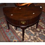 18th century oak tea table, demi-lune form with fold top, central frieze drawer raised on tapering