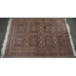 Caucasian carpet, multi-gull border and central geometric designs on a mainly puce field, 2m x 1.3m