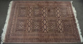 Caucasian carpet, multi-gull border and central geometric designs on a mainly puce field, 2m x 1.3m