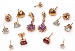 Mixed Lot: three pairs of 9ct gold earrings to include a tri-coloured gold set, garnet, and amethyst