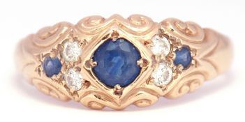 9ct gold sapphire and diamond ring centring a circular faceted sapphire between 2 smaller