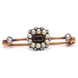 Mourning bar brooch, the centre an oval glazed plaited hair panel within a seed pearl surround, each