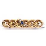 Antique 15ct stamped brooch of elongated form featuring six entwined links, centring a small