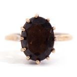 9ct gold smokey quartz ring of oval faceted shape, multi-claw set to a high basket collet, gross