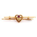 9ct stamped double bar brooch centring an open work heart design, set with a small circular pink