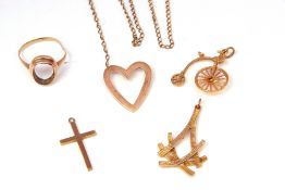 Mixed Lot: 9ct gold penny farthing charm, a 9ct textured pendant, a 9ct cross pendant, a broken open