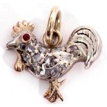 Victorian diamond set cockerel pendant, having a red stone eye and highlighted throughout with small