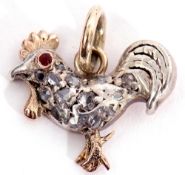 Victorian diamond set cockerel pendant, having a red stone eye and highlighted throughout with small