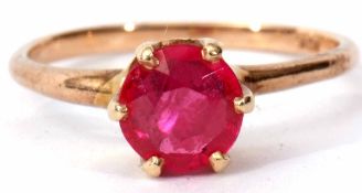 Modern synthetic ruby ring of circular faceted design, claw and coronet set in a plain 10K stamped
