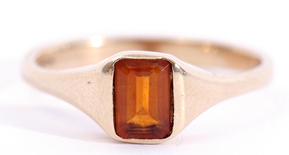 9ct gold citrine ring, the emerald cut dark citrine in a rub-over square profile shank, London,