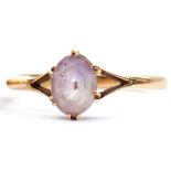 Quartz single stone ring, an oval faceted vari-coloured quartz, lilac to colourless, set with six