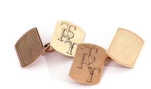 Pair of 9ct gold cuff links of rectangular shaped form, one side engraved with entwined initials,