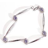 Modern precious metal sapphire and diamond set articulated bracelet, a design featuring 5 plain