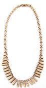 9ct gold "Cleopatra" fringe necklace, three rows of graduated brick links, fully articulated to a