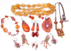 Mixed Lot: modern amber jewellery to include pendant earrings, bracelets etc, together with an agate