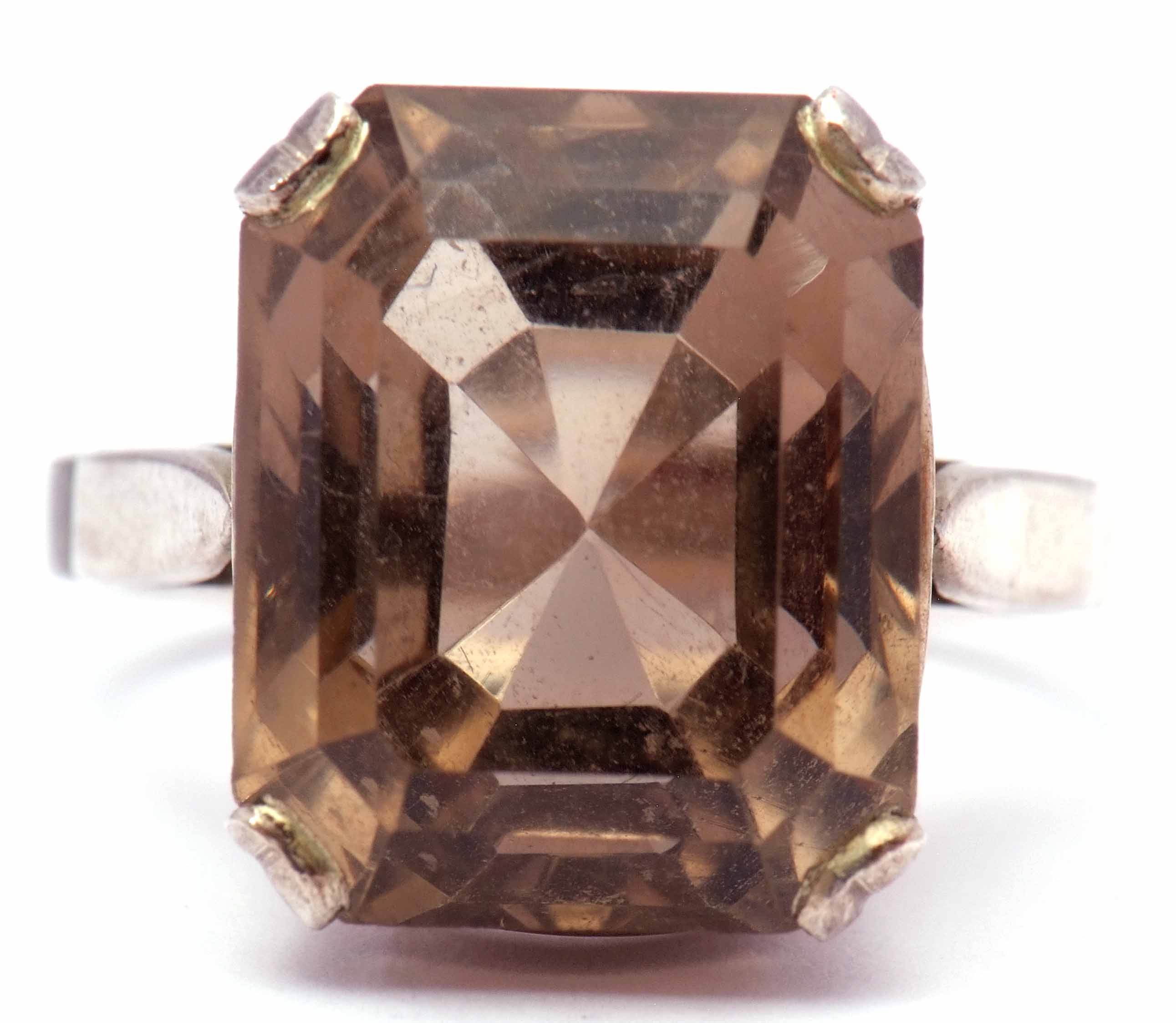 Modern stepped cut quartz dress ring raised in a pierced box white metal mount, size M