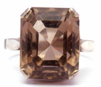Modern stepped cut quartz dress ring raised in a pierced box white metal mount, size M