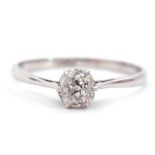 Single stone diamond ring, an old cut diamond set in a six-claws to a pierced heart coronet style
