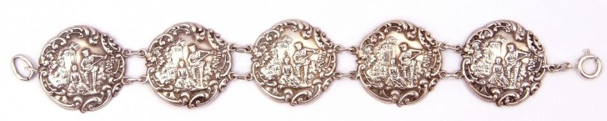 Antique silver embossed bracelet, a design featuring five circular panels with chain link