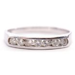 18ct white gold diamond set half eternity ring, channel set with 7 round brilliant cut diamonds, 0.