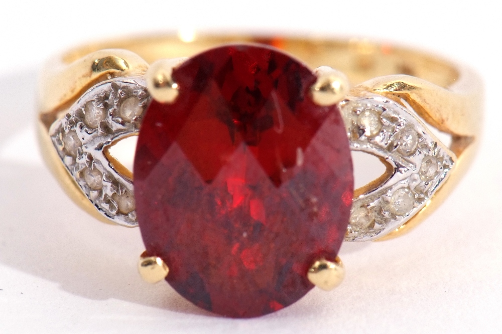 Modern garnet and diamond dress ring, the oval faceted garnet raised between diamond pierced - Image 7 of 7